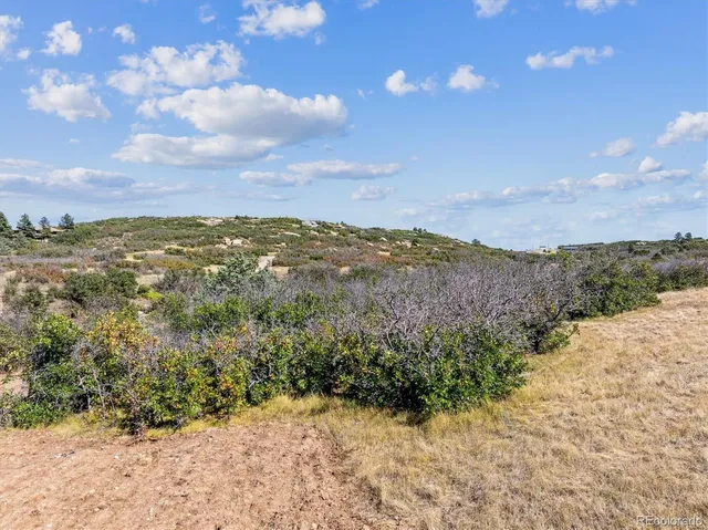 a view of a lake with mountains in the background