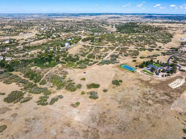 an aerial view of residential building and lake