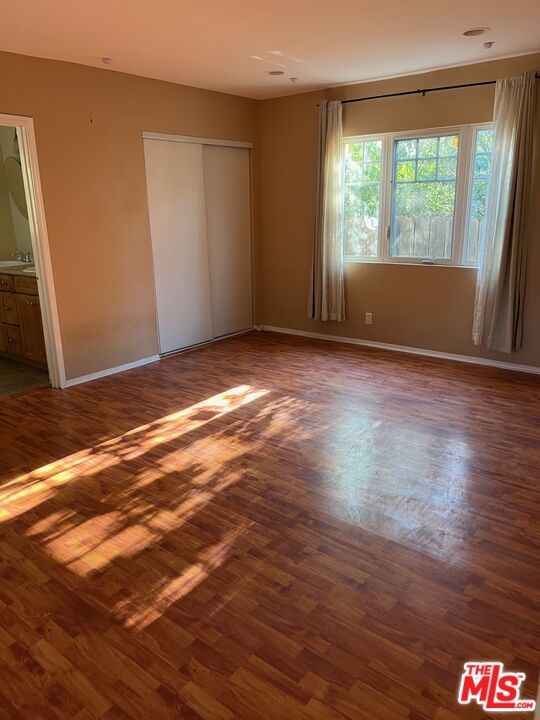 17844 Hartland Street Reseda, CA 91335 - Photo 13 of 18 a view of empty room with wooden floor and fan