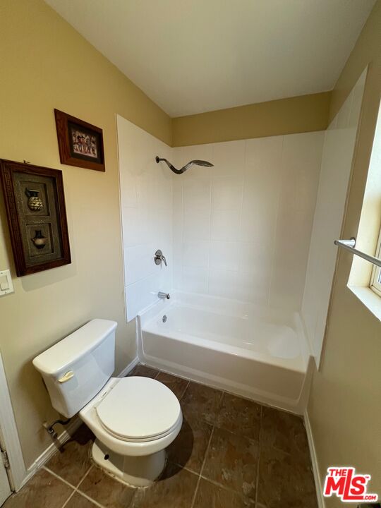 17844 Hartland Street Reseda, CA 91335 - Photo 14 of 18 a bathroom with a toilet and a shower