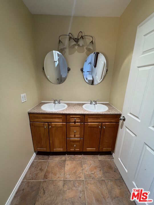 17844 Hartland Street Reseda, CA 91335 - Photo 15 of 18 a room with cabinets and wooden floor