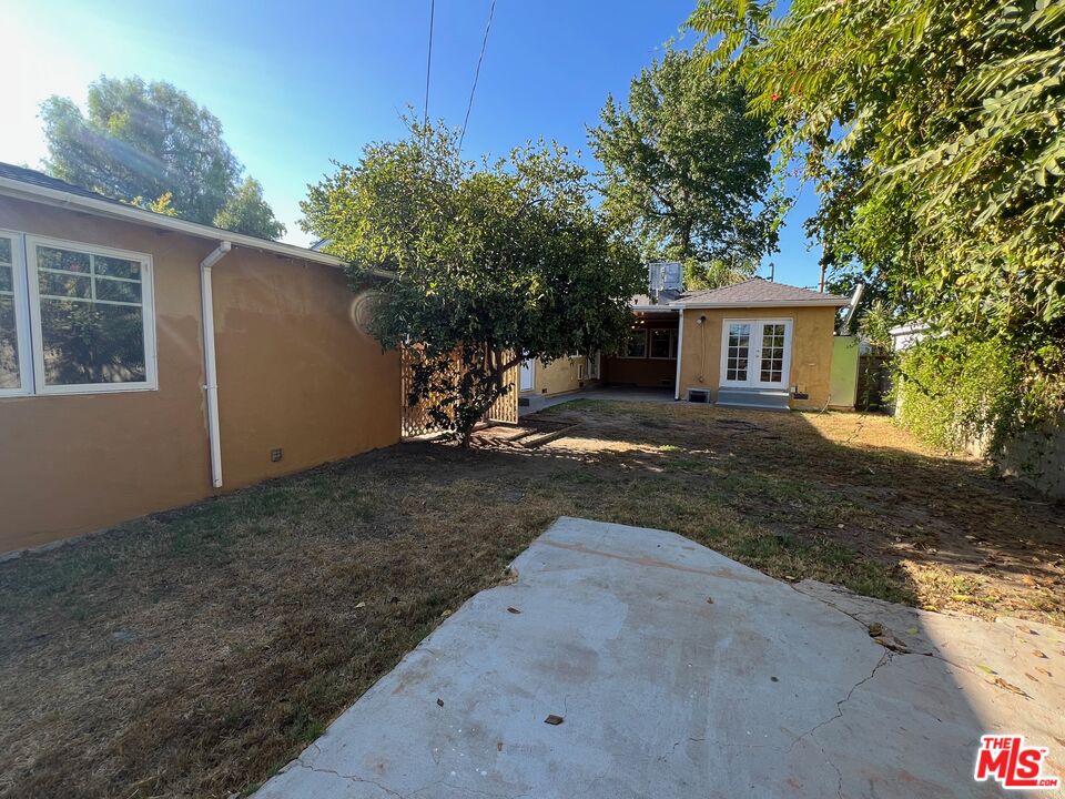 17844 Hartland Street Reseda, CA 91335 - Photo 17 of 18 a view of a backyard with a tree