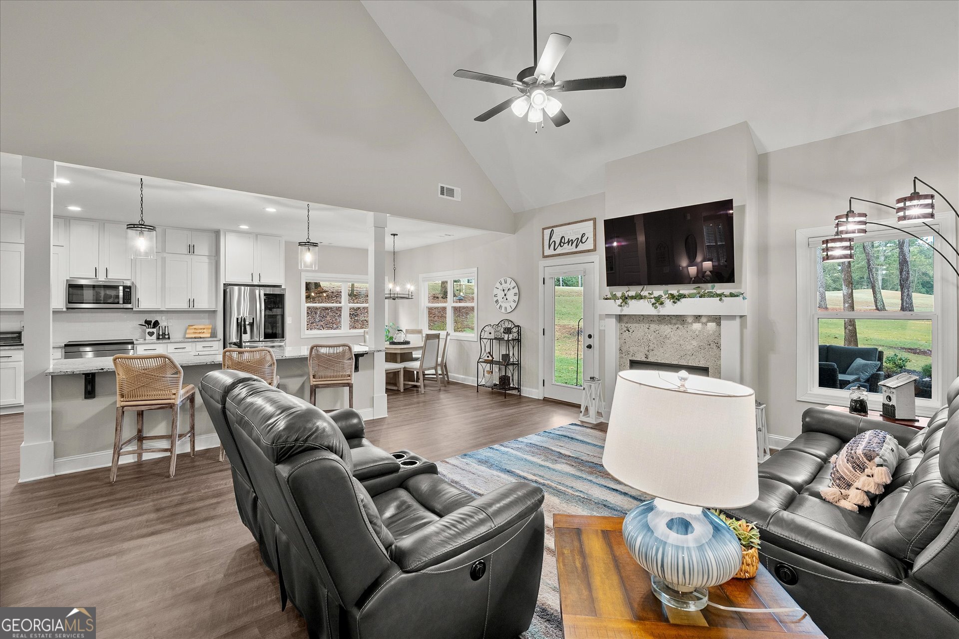 3260 Greenhill Court Villa Rica, GA 30180 - Photo 12 of 80 a living room with furniture a flat screen tv and a fireplace