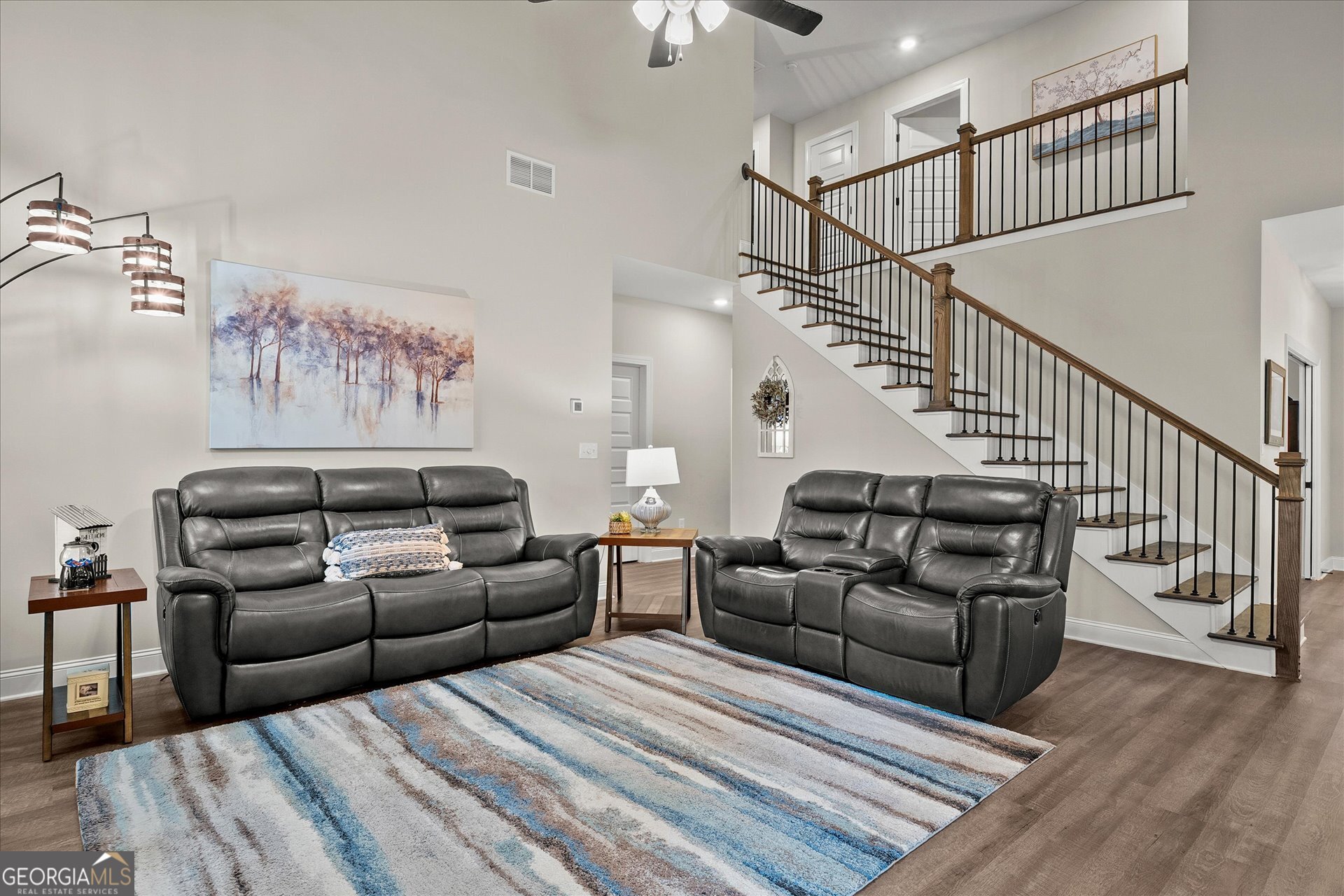 3260 Greenhill Court Villa Rica, GA 30180 - Photo 13 of 80 a living room with furniture or stairs and a wooden floor
