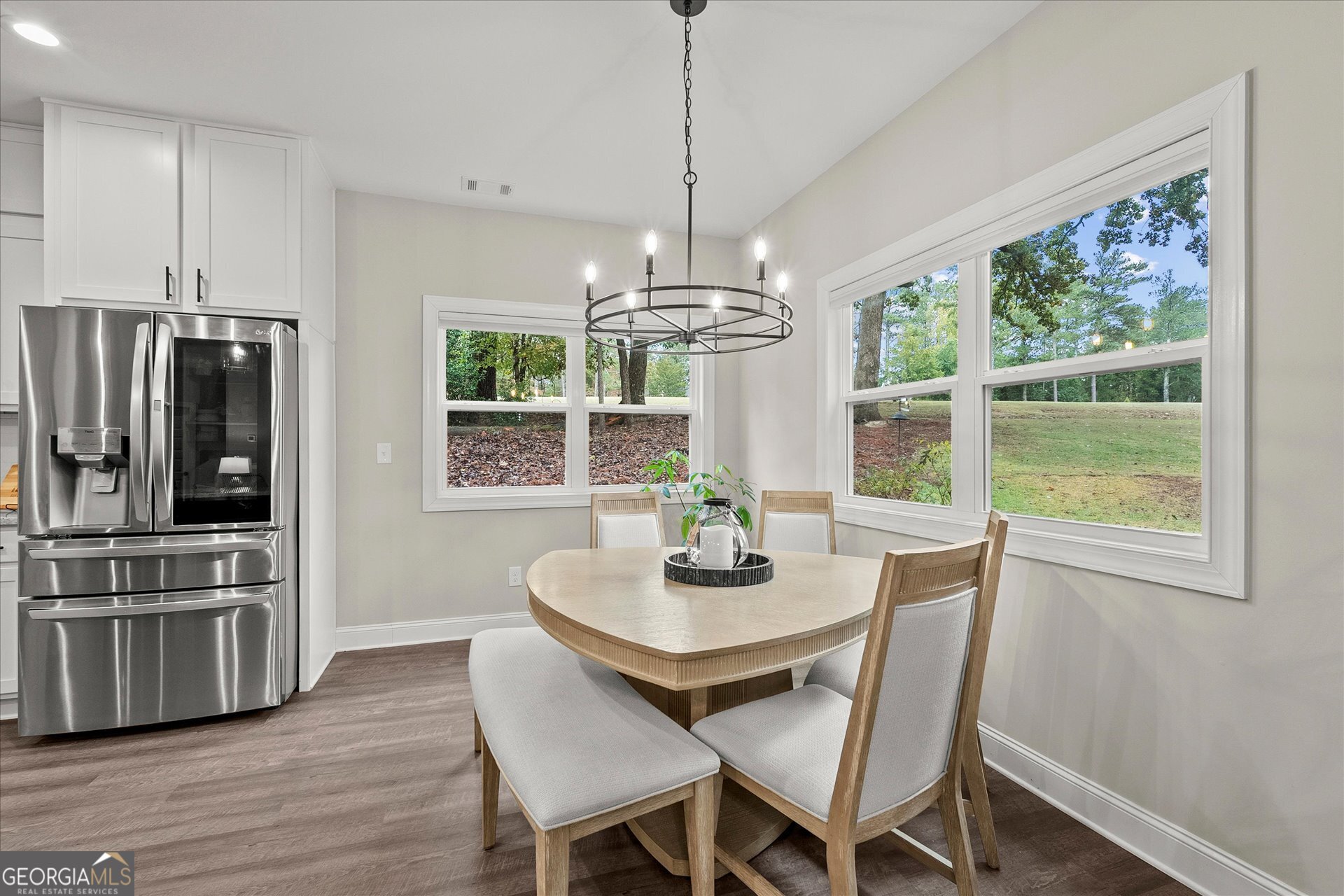 3260 Greenhill Court Villa Rica, GA 30180 - Photo 15 of 80 a view of a dining room with furniture large window and wooden floor