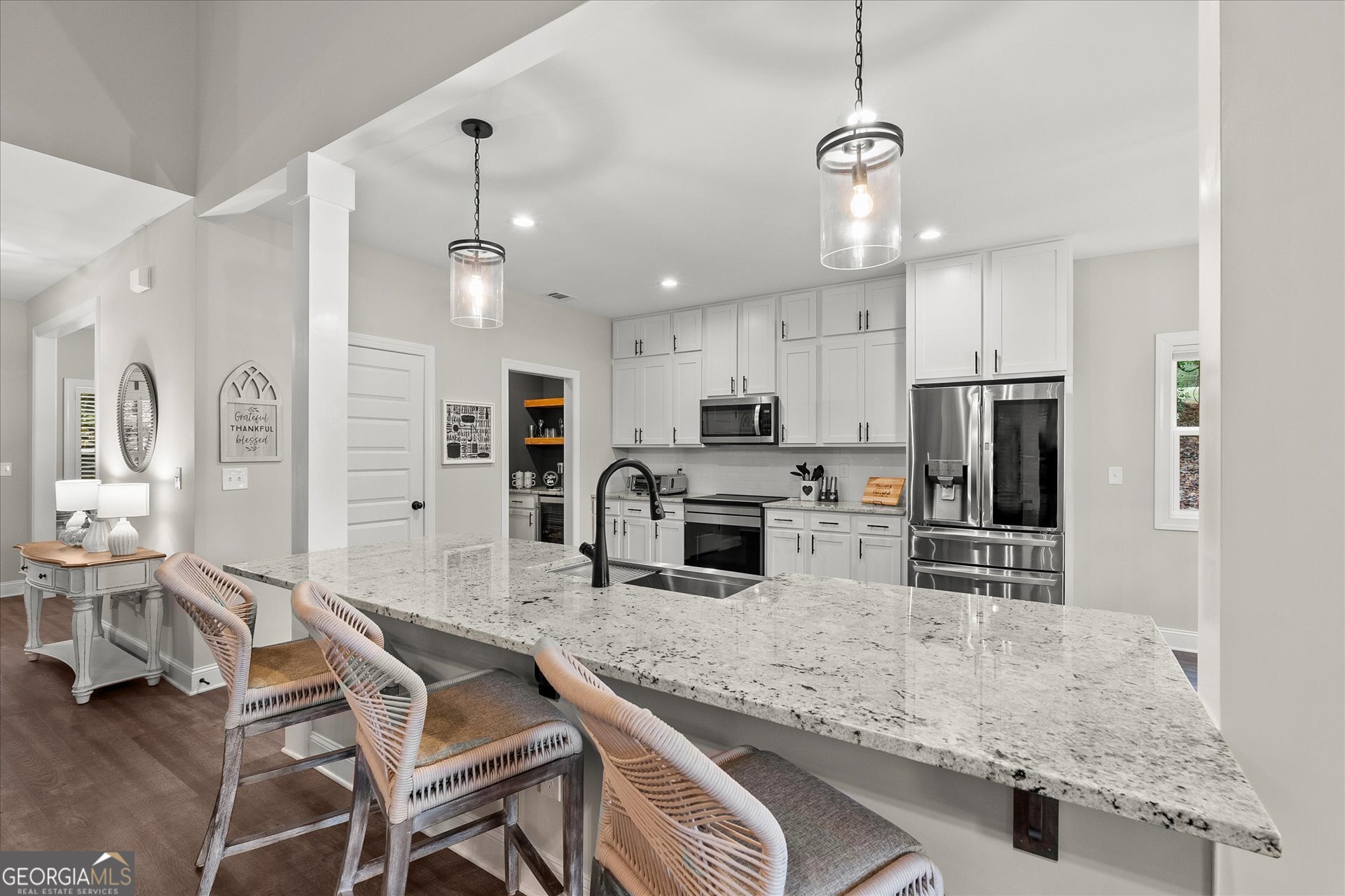 3260 Greenhill Court Villa Rica, GA 30180 - Photo 18 of 80 a kitchen with stainless steel appliances granite countertop a sink refrigerator and cabinets