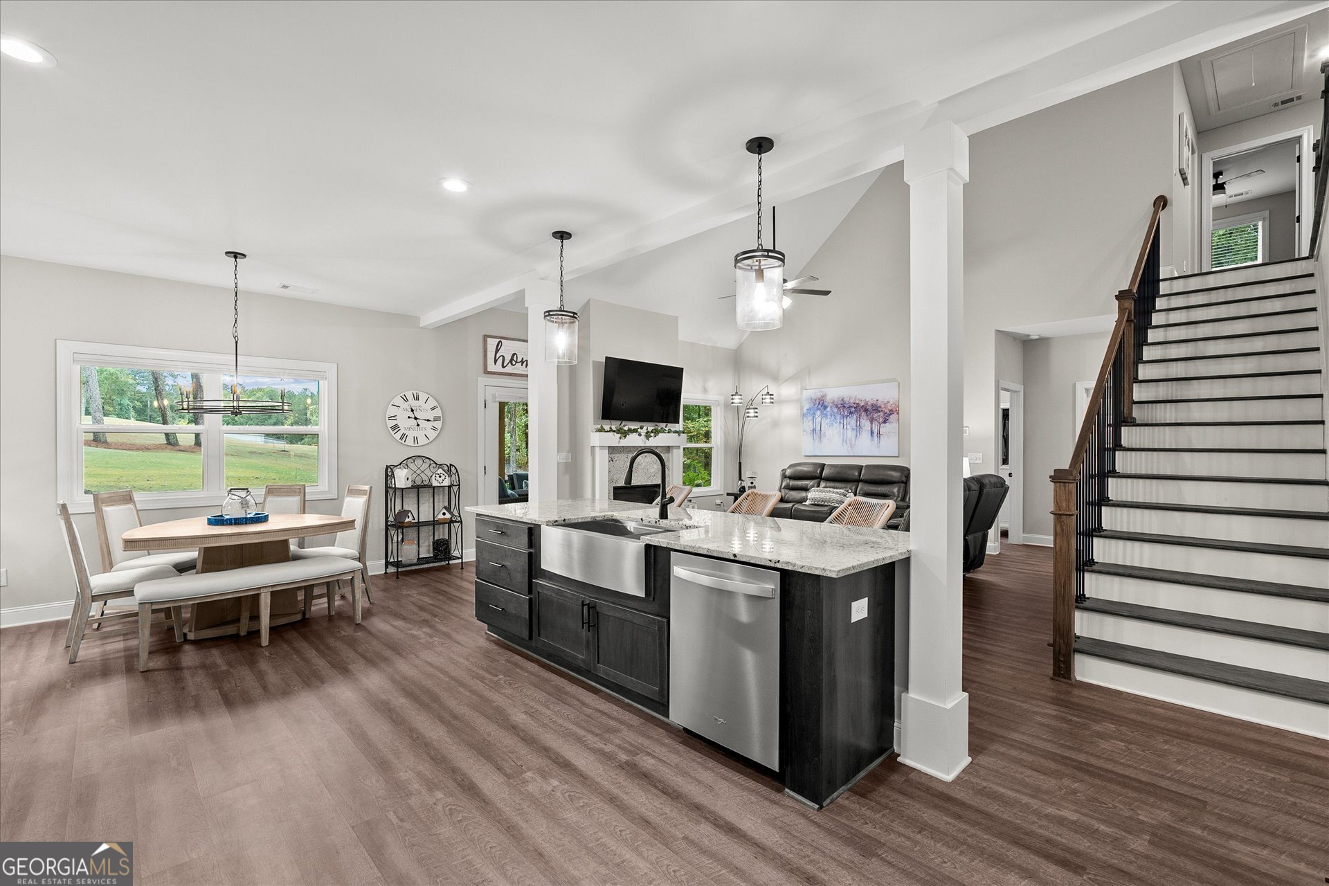 3260 Greenhill Court Villa Rica, GA 30180 - Photo 21 of 80 a kitchen with stainless steel appliances kitchen island wooden floors and white walls
