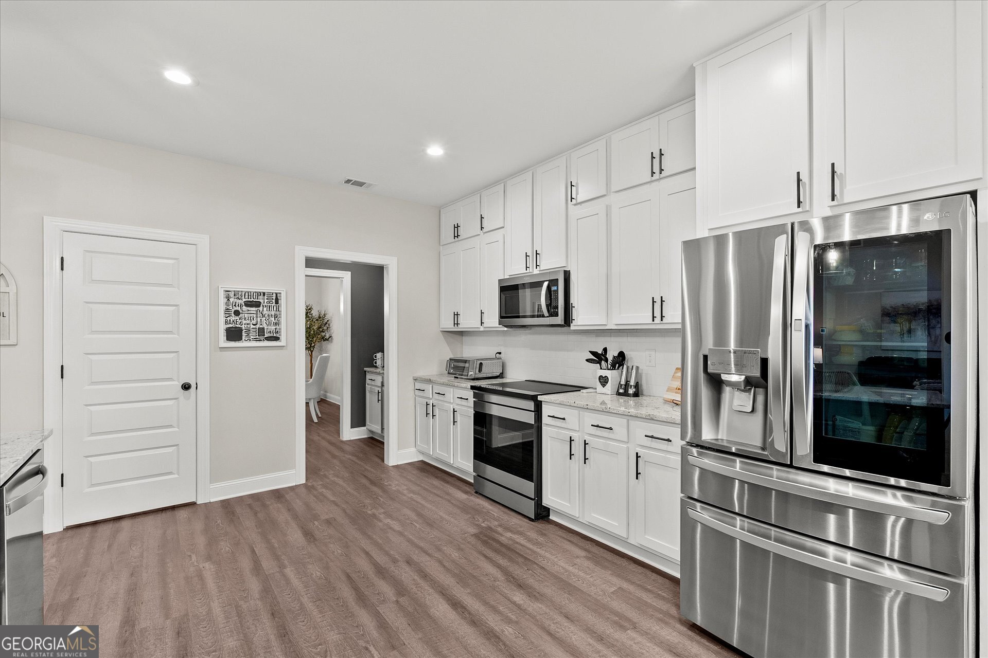 3260 Greenhill Court Villa Rica, GA 30180 - Photo 22 of 80 a kitchen with stainless steel appliances a refrigerator sink and cabinets