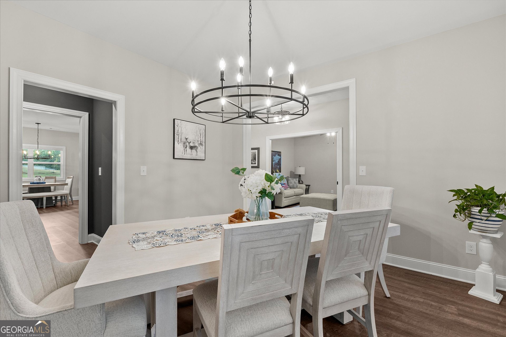 3260 Greenhill Court Villa Rica, GA 30180 - Photo 27 of 80 a dining room with furniture a chandelier and wooden floor
