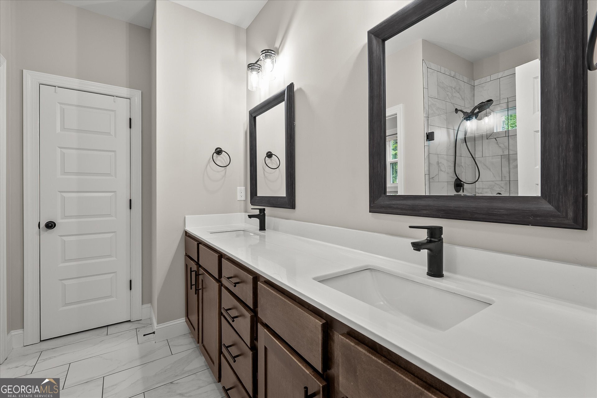 3260 Greenhill Court Villa Rica, GA 30180 - Photo 33 of 80 a bathroom with a sink and a mirror
