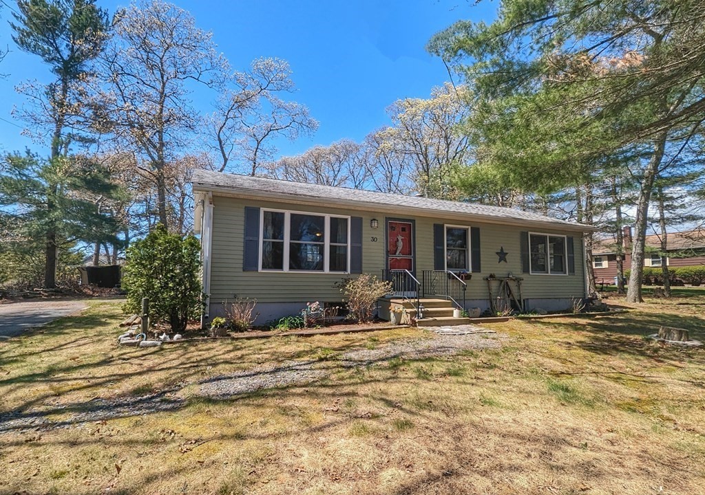 30 Cohasset Road Buzzards Bay, MA 02532 - Photo 1 of 24 a front view of a house with yard porch and seating space