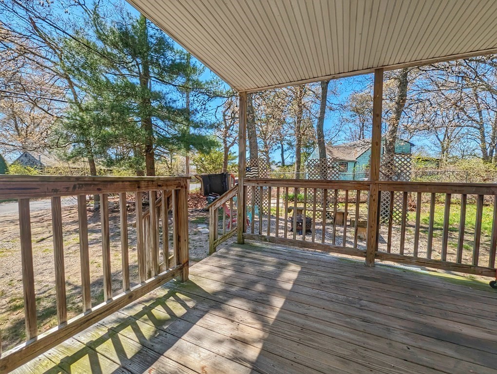 30 Cohasset Road Buzzards Bay, MA 02532 - Photo 2 of 24 a balcony with wooden floor and outdoor space