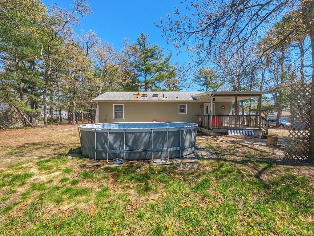 30 Cohasset Road Buzzards Bay, MA 02532 - Photo 3 of 24 a view of a house with a yard and sitting area