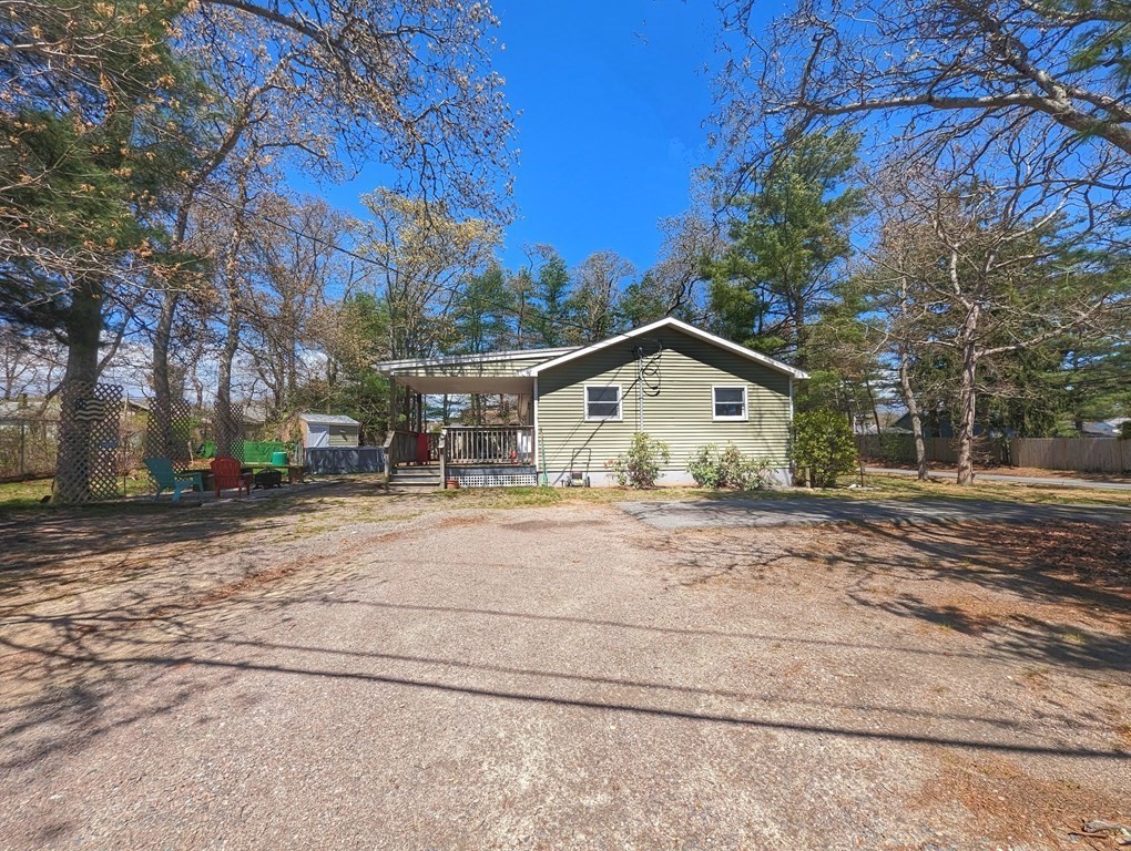 30 Cohasset Road Buzzards Bay, MA 02532 - Photo 4 of 24 a view of a house with a yard covered in snow