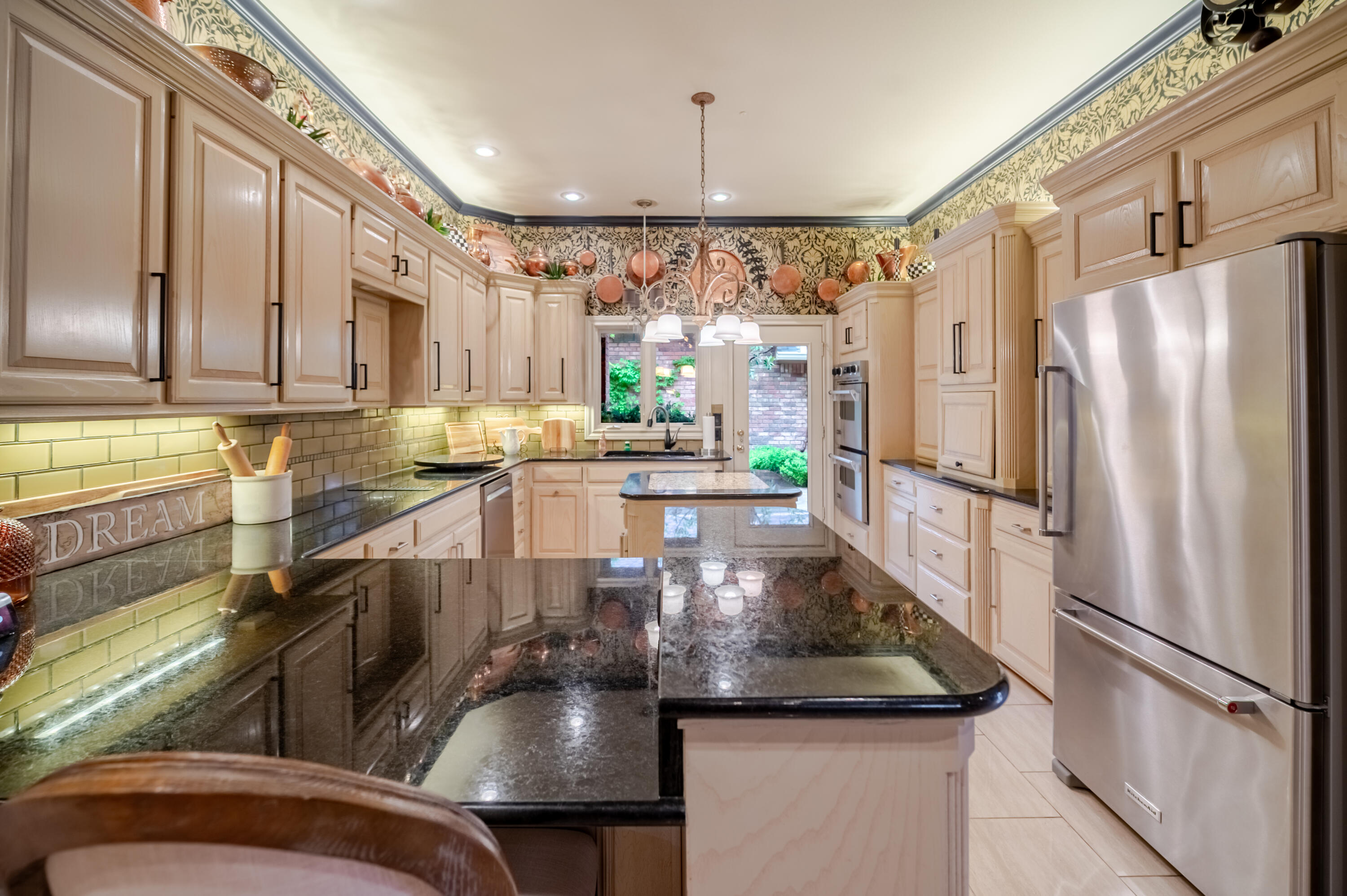 4226 97th Place Lubbock, TX 79423 - Photo 21 of 52 a kitchen with stainless steel appliances granite countertop a refrigerator a sink and a stove