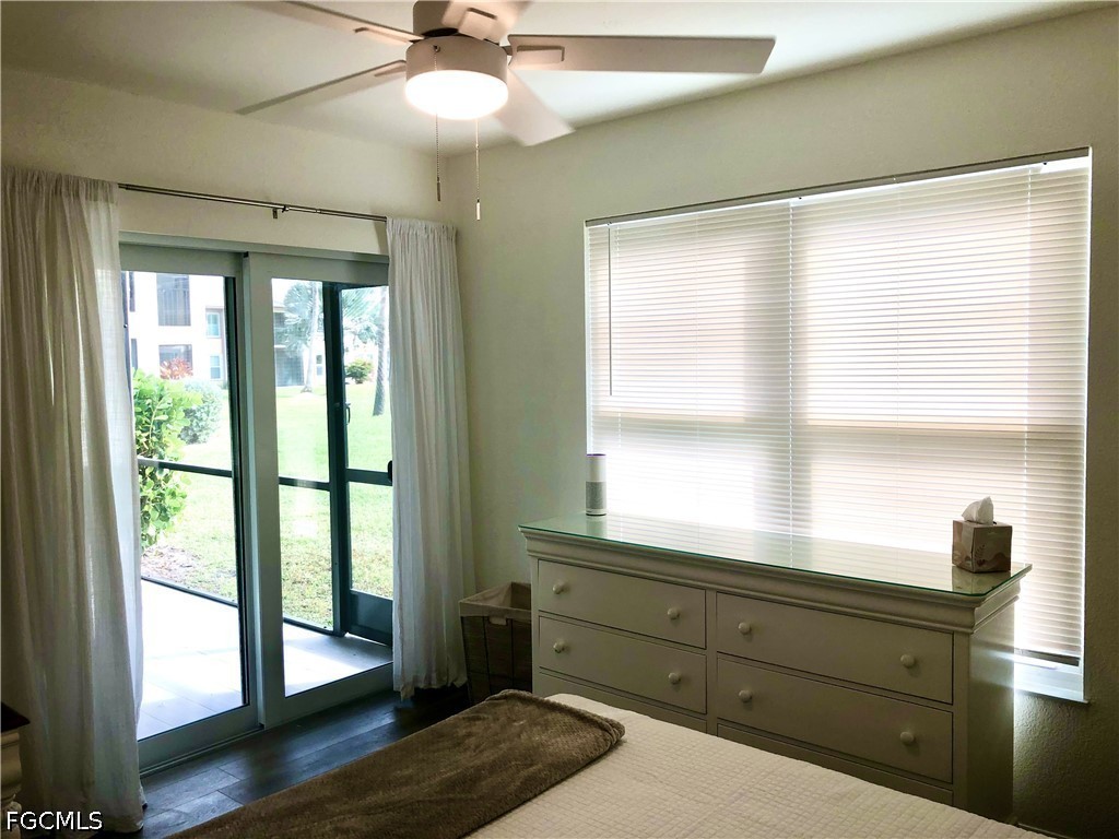 16881 Davis Road, Unit 214 Fort Myers, FL 33908 - Photo 17 of 46 a room with a large window and wooden floor