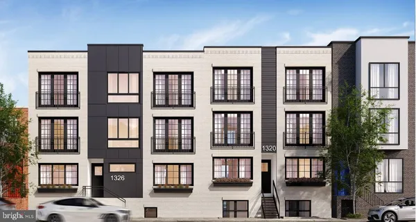 a front view of a residential apartment building with a lot of windows