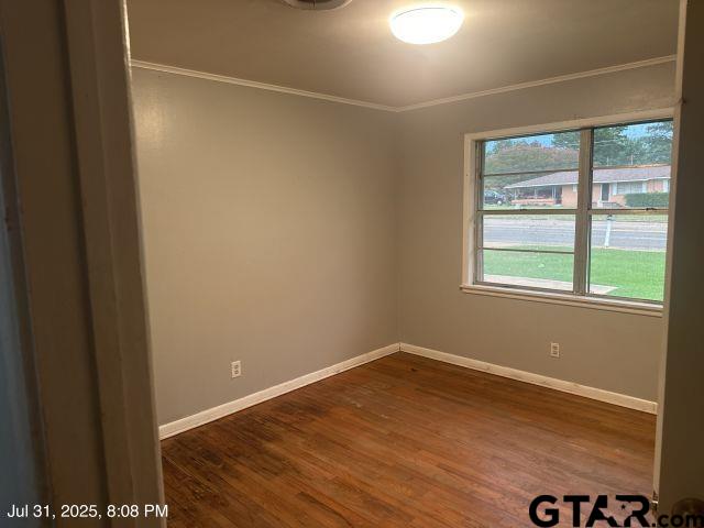 2205 Pine Tree Road Longview, TX 75604 - Photo 16 of 20 a view of a room with wooden floor and windows