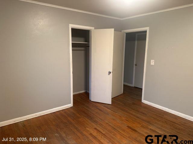 2205 Pine Tree Road Longview, TX 75604 - Photo 17 of 20 an empty room with wooden floor and closet