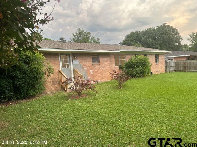 2205 Pine Tree Road Longview, TX 75604 - Photo 6 of 20 a front view of a house with garden