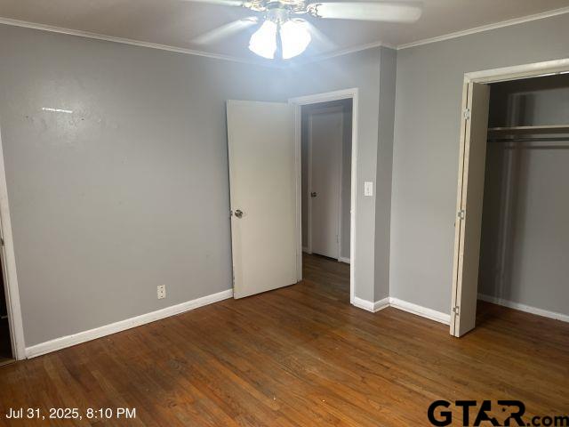 2205 Pine Tree Road Longview, TX 75604 - Photo 9 of 20 a view of an empty room with wooden floor and a window