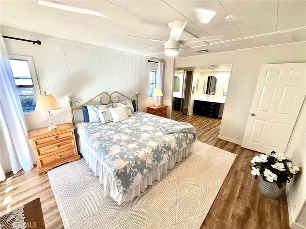 a bedroom with a large bed and a couch