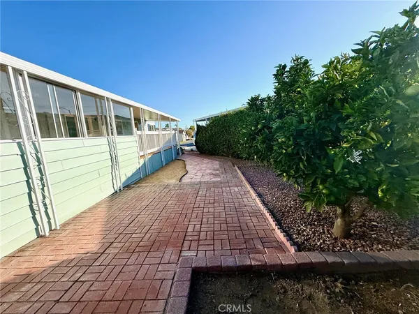 a view of balcony with wooden floor and fence