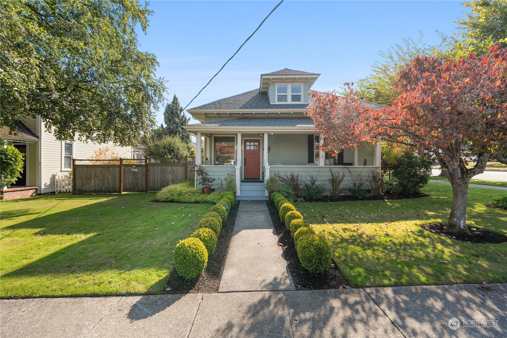 a front view of house with yard and green space