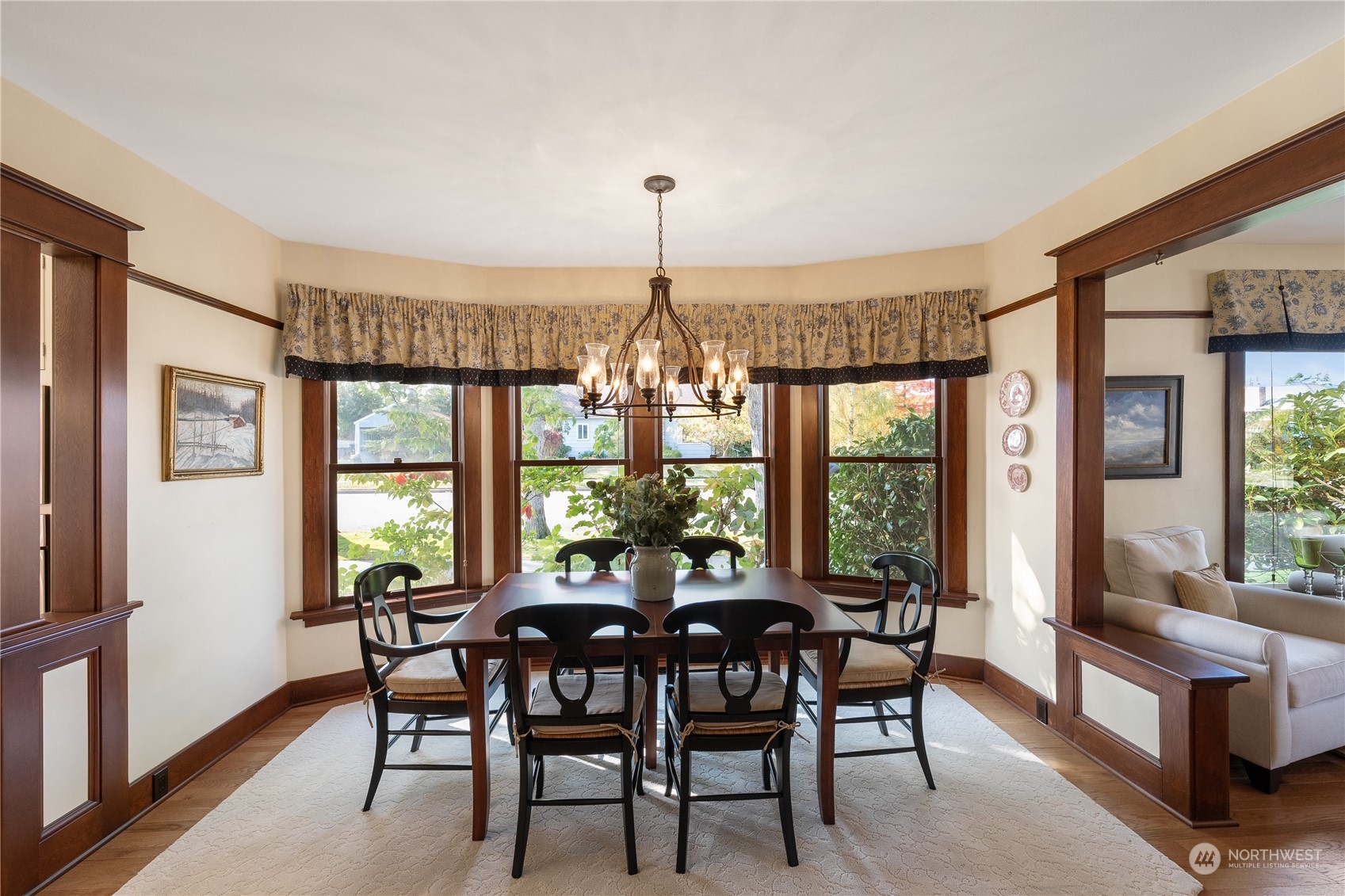 1317 9th Street Anacortes, WA 98221 - Photo 12 of 38 a view of a dining room with furniture large windows and wooden floor