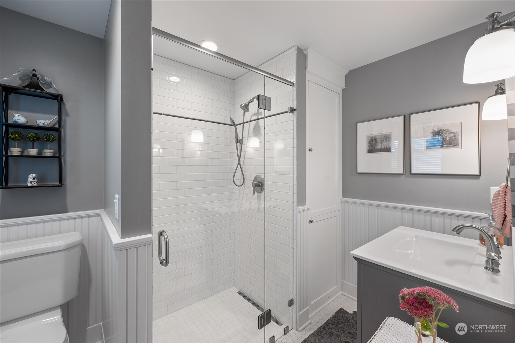 1317 9th Street Anacortes, WA 98221 - Photo 16 of 38 a bathroom with a sink vanity and shower
