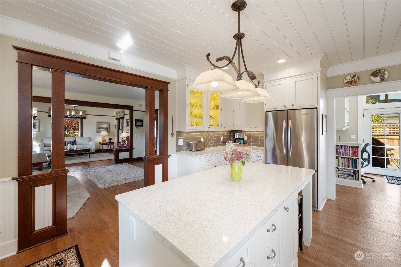 1317 9th Street Anacortes, WA 98221 - Photo 20 of 38 a kitchen with sink refrigerator and dining table