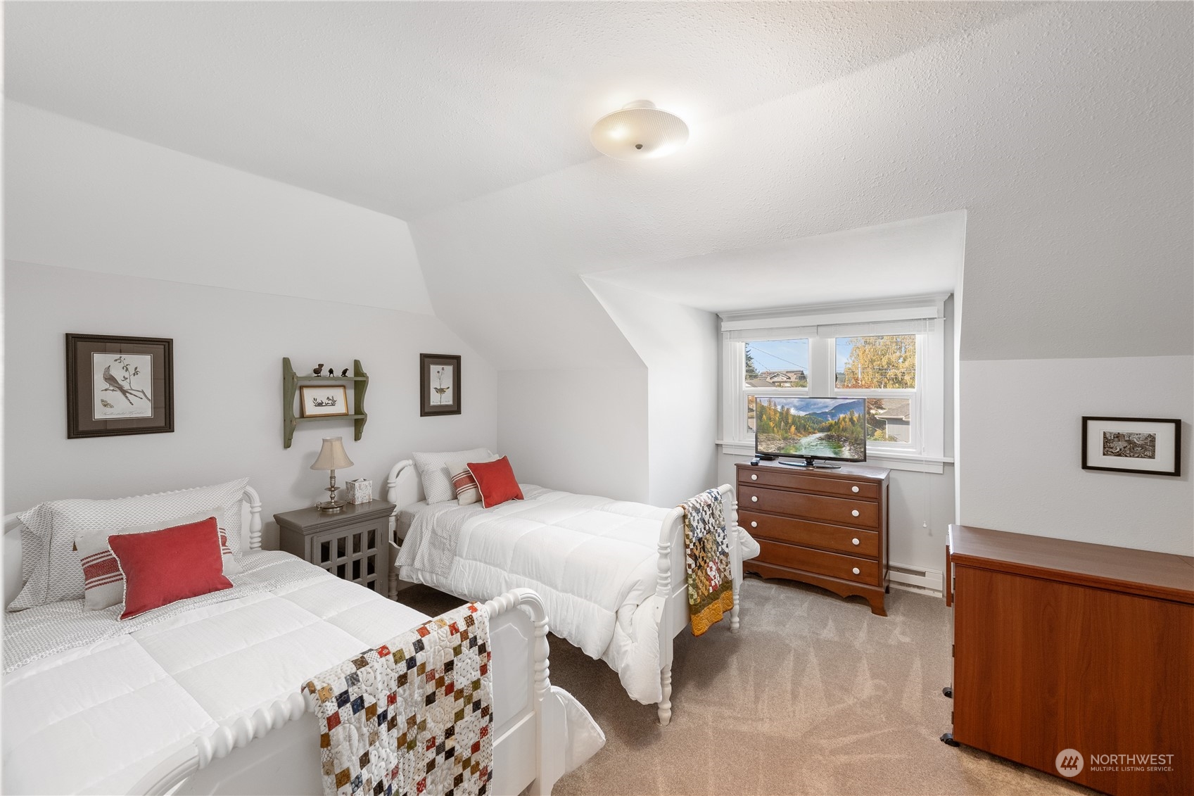 1317 9th Street Anacortes, WA 98221 - Photo 25 of 38 a bedroom with a bed and a dresser