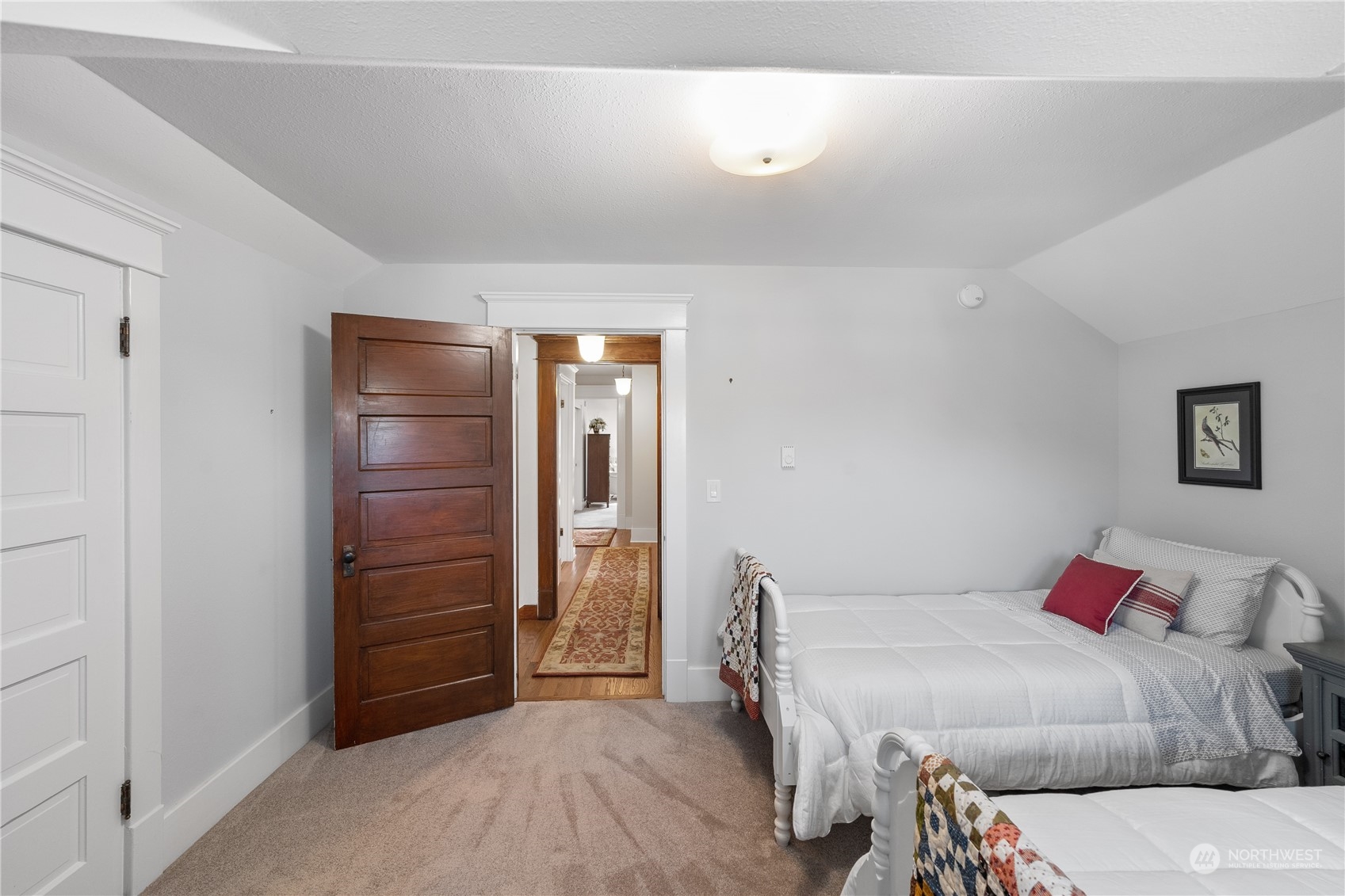 1317 9th Street Anacortes, WA 98221 - Photo 26 of 38 a bedroom with a bed and a cabinets