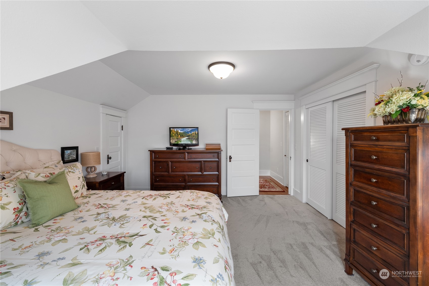 1317 9th Street Anacortes, WA 98221 - Photo 31 of 38 a bedroom with a bed and a dresser