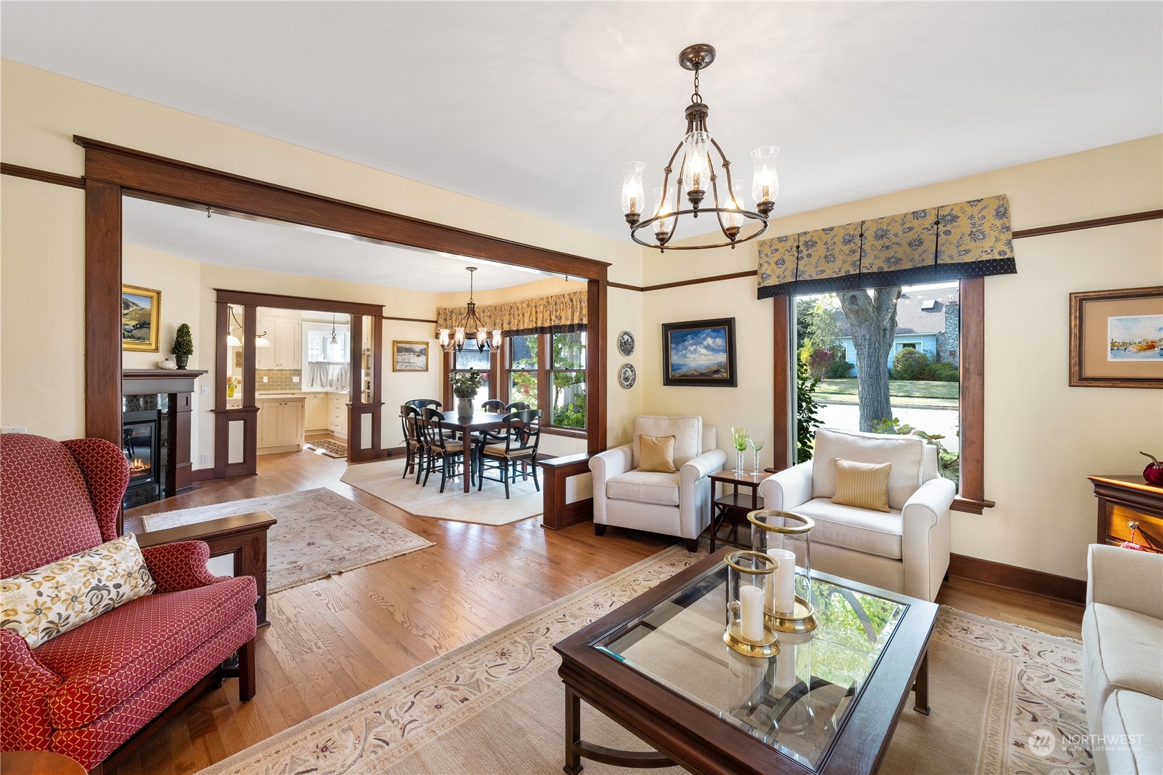 1317 9th Street Anacortes, WA 98221 - Photo 8 of 38 a living room with fireplace furniture and a chandelier