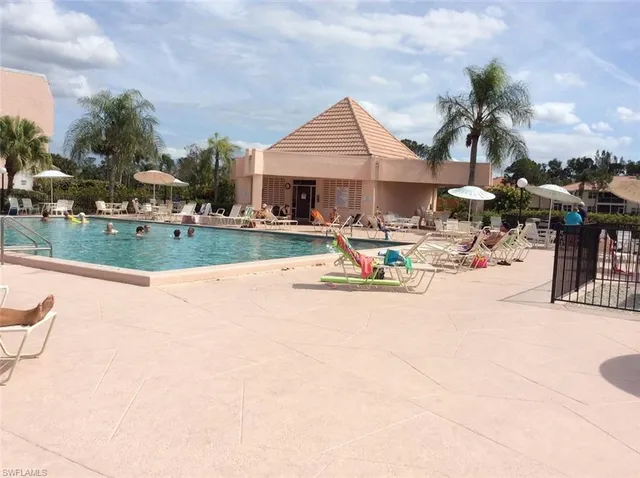 a view of a house with sitting area and fire pit