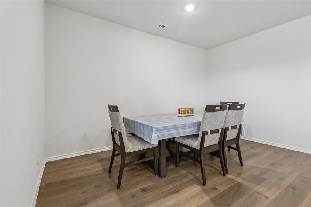 1453 Millstead Rill Road Caddo Mills, TX 75135 - Photo 14 of 40 Spacious room featuring light-toned walls, wood-finish flooring, and recessed ceiling lighting