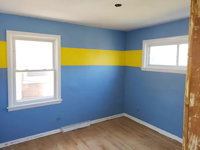 a view of an empty room with a window