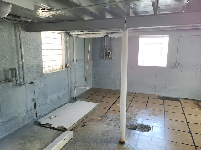 a bathroom with a glass shower door