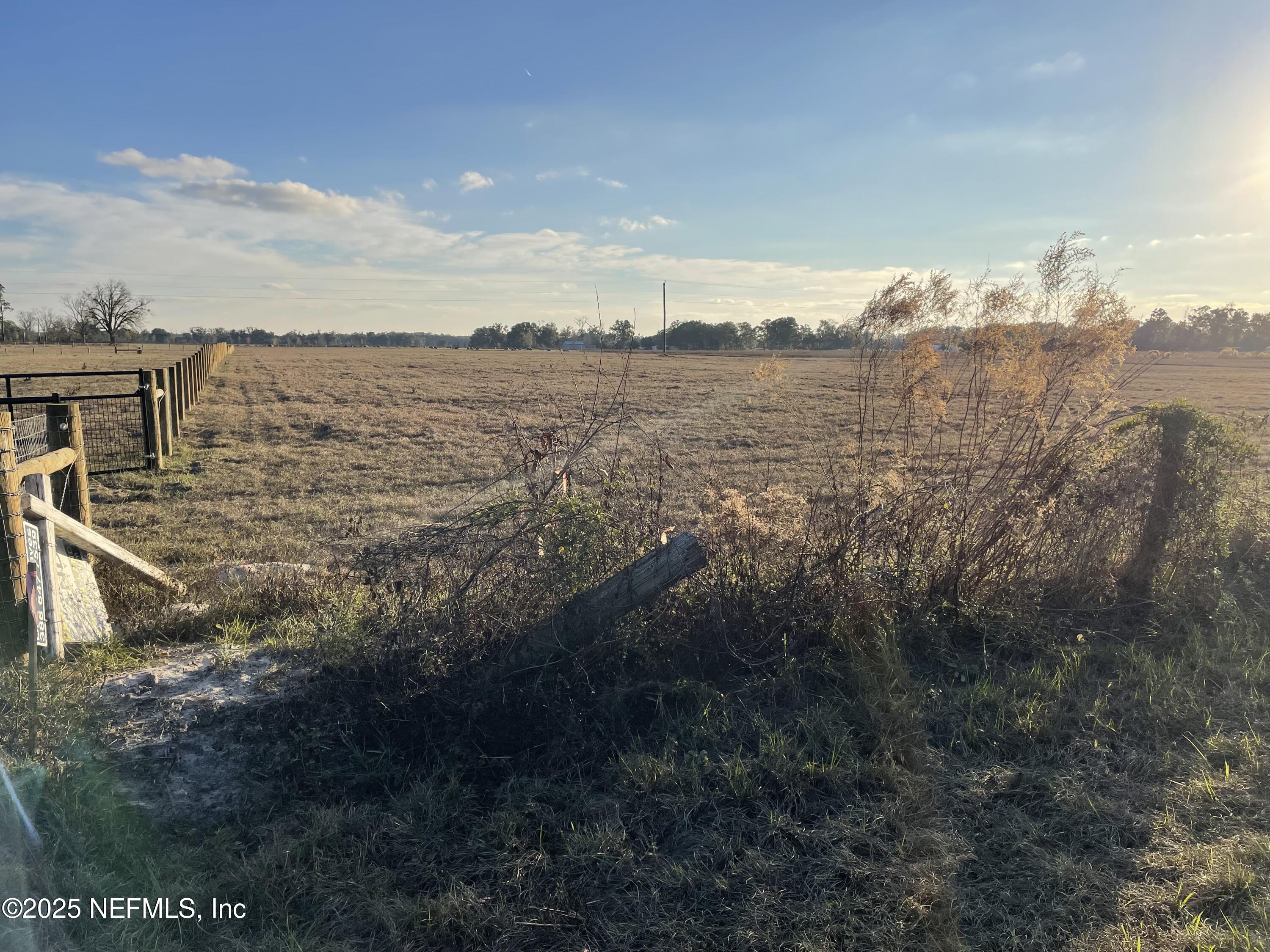 8516 240th Street O'Brien, FL 32071 - Photo 11 of 12 a view of a lake with a mountain