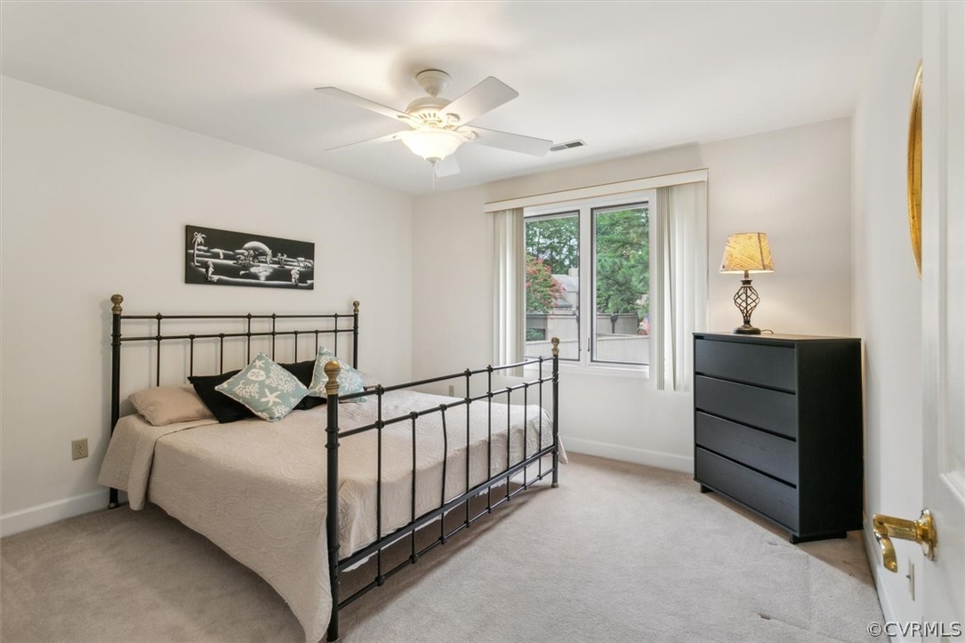 118 Harrops Glen Williamsburg, VA 23185 - Photo 37 of 44 a bedroom with a bed and a chandelier