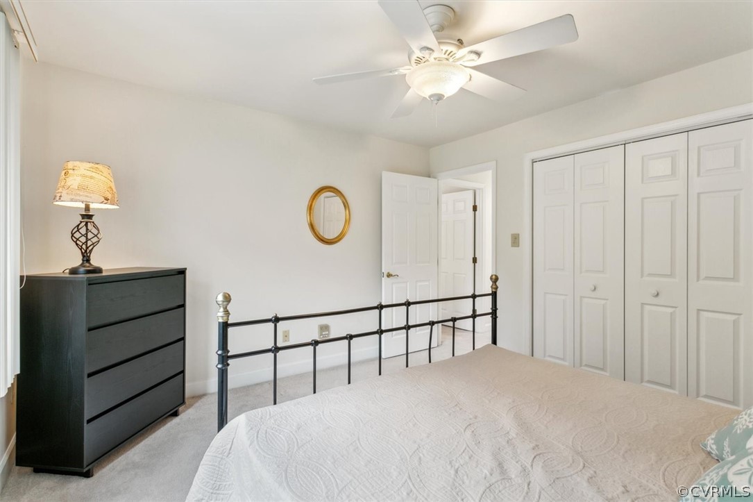 118 Harrops Glen Williamsburg, VA 23185 - Photo 38 of 44 a bedroom with a bed and a chandelier