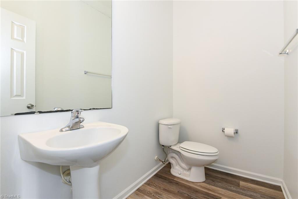 1161 Glory Vine Road Whitsett, NC 27377 - Photo 19 of 43 half bath on Main level.