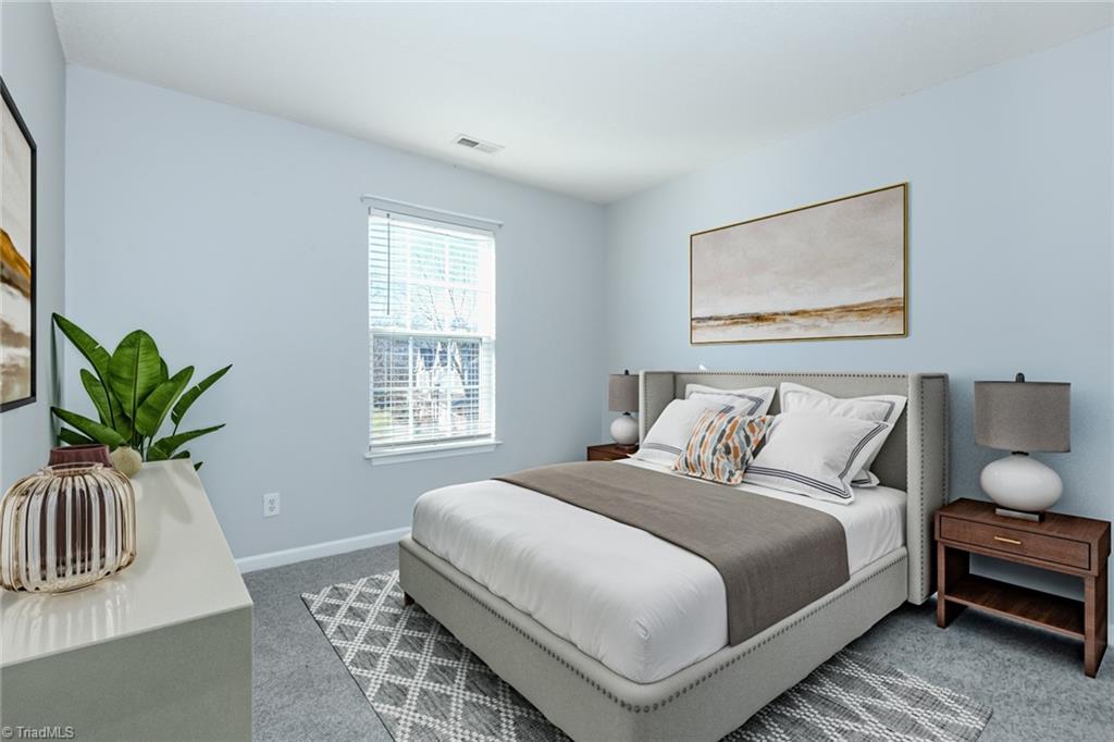 1161 Glory Vine Road Whitsett, NC 27377 - Photo 31 of 43 Bedroom 3 staged.