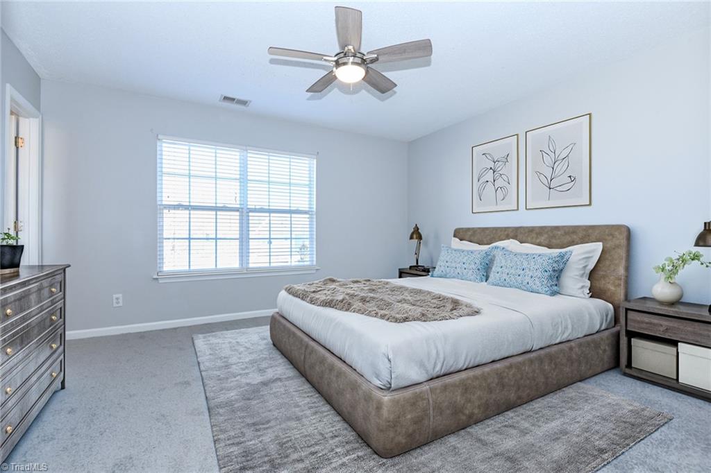 1161 Glory Vine Road Whitsett, NC 27377 - Photo 33 of 43 Primary Bedroom