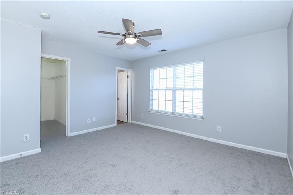 1161 Glory Vine Road Whitsett, NC 27377 - Photo 35 of 43 Primary Bedroom
