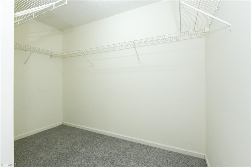 1161 Glory Vine Road Whitsett, NC 27377 - Photo 37 of 43 Huge primary Walk-in closet.