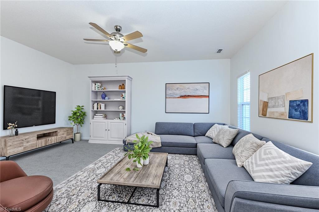 1161 Glory Vine Road Whitsett, NC 27377 - Photo 6 of 43 Living Room staged