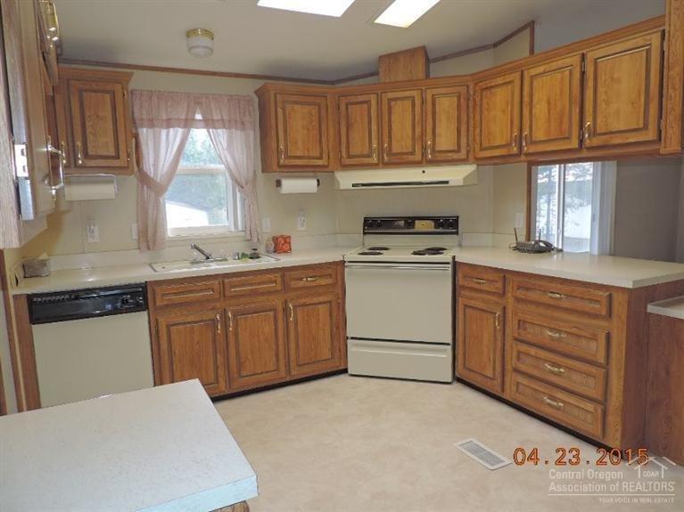 53255 Deep Woods Road La Pine, OR 97739 - Photo 9 of 25 Nice bright kitchen has lots of cabinets