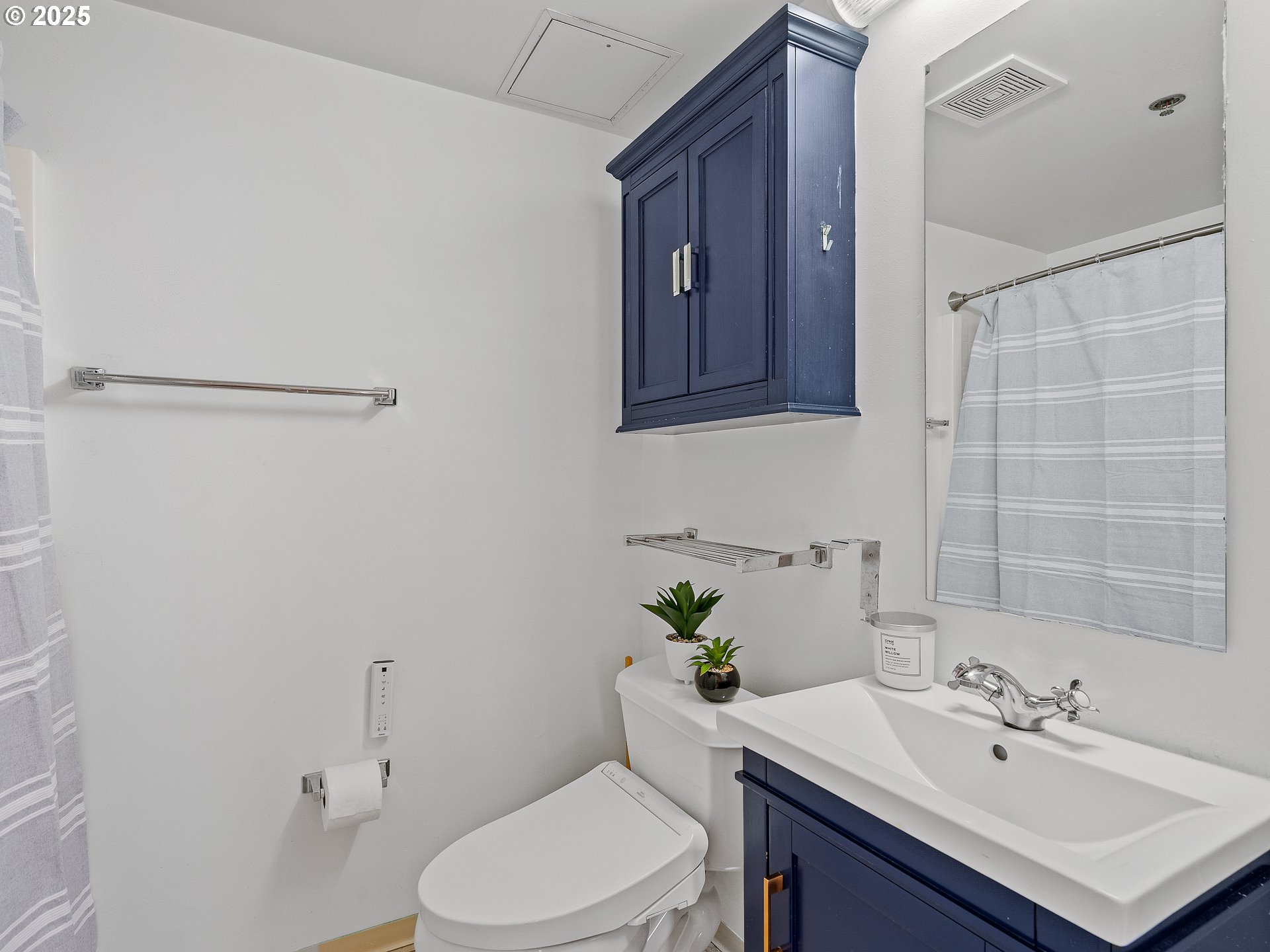 533 Northeast Holladay Street, Unit 605 Portland, OR 97232 - Photo 24 of 42 a bathroom with a sink a toilet and shower